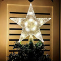 Étoile lumineuse cime de sapin
