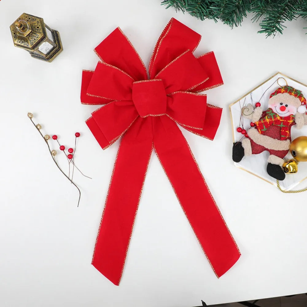Grand nœud en velours rouge – porte & sapin
