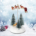 Village de Noël animé avec traîneau volant
