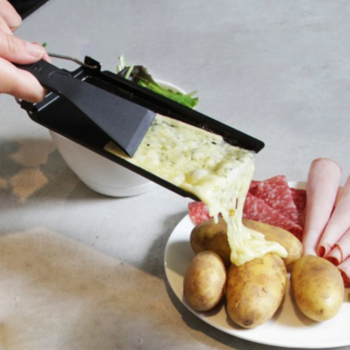Mini-raclette à bougie manche en bois